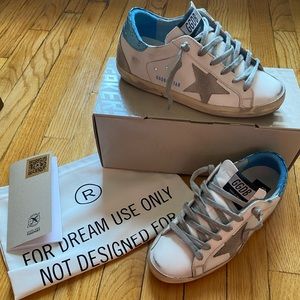 Golden Goose with blue laminated tab